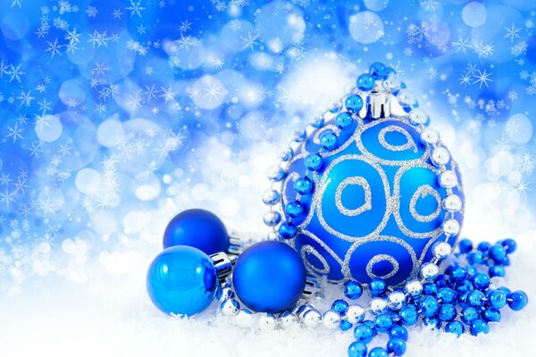 Blue Christmas balls on a blue background