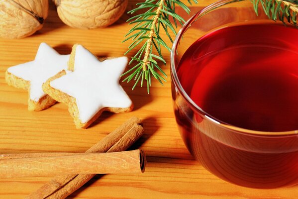 Mug of tea, ginger cookies and cinnamon