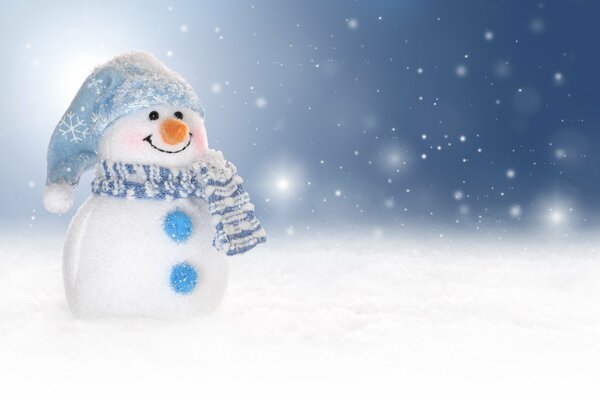 The snowman in the blue hat smiles