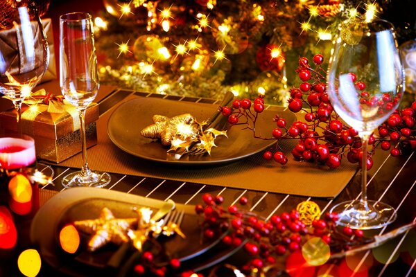 A covered New Year s table with dishes and decorations