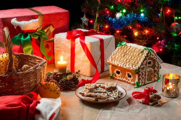 Christmas cookies candles gifts and a basket of oranges