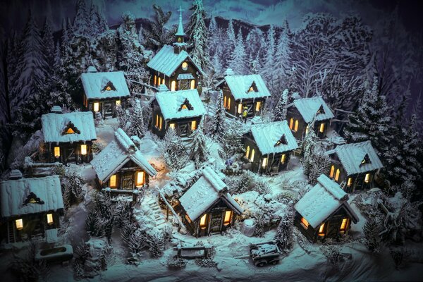 Casas de invierno en la nieve con ventanas