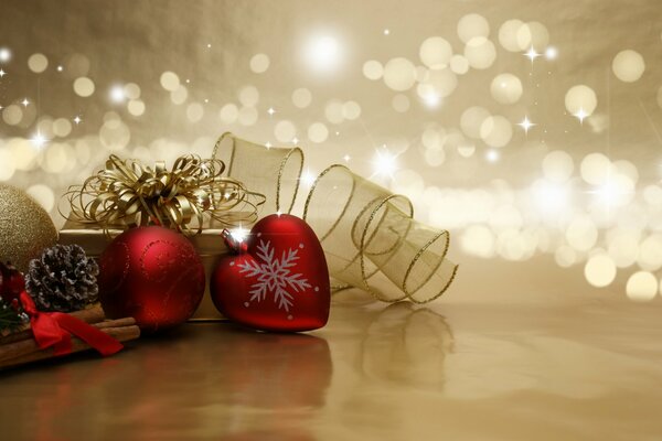 Christmas decorations with cones and ribbons on a golden background