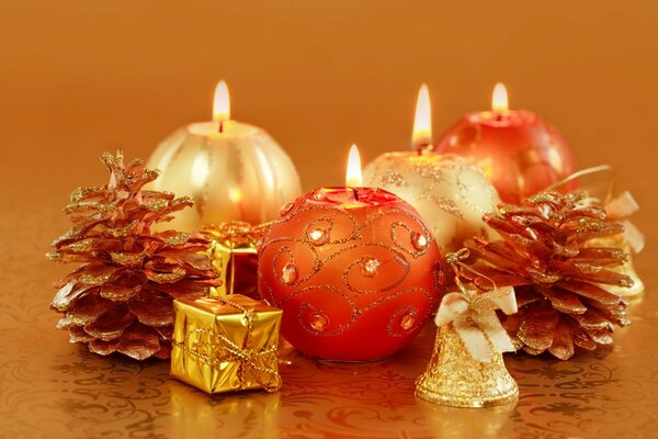 Cozy atmosphere of New Year and Christmas with candles and cones