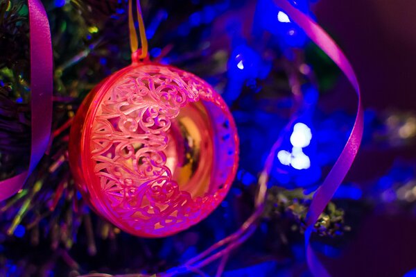 New Year s ball on the background of a burning garland