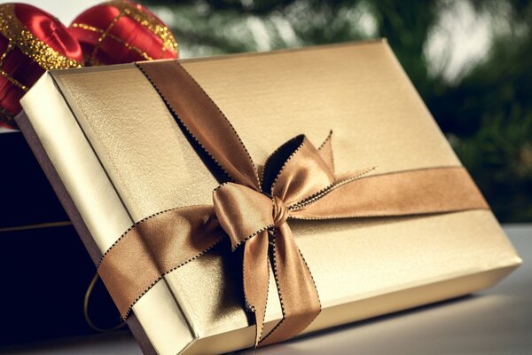 Gift box with a golden bow