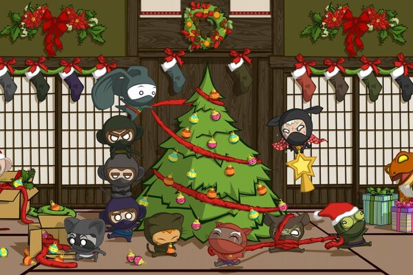 Gli uomini Ninja decorano l albero di Natale