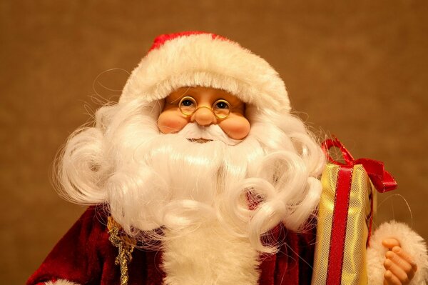 Santa Claus doll with a gift