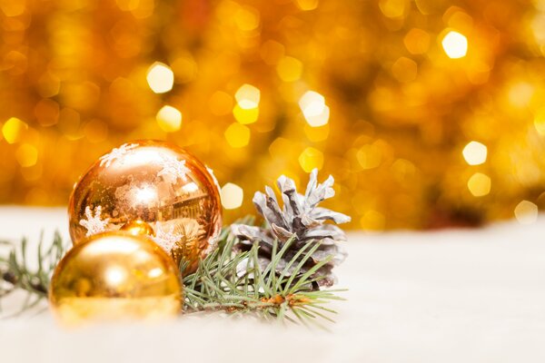 Christmas golden balls and a fir branch