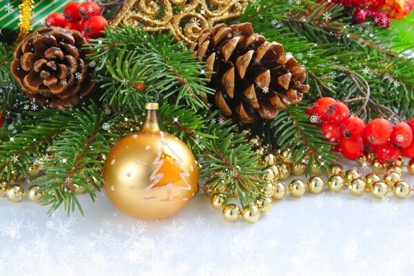 A golden ball on a coniferous branch