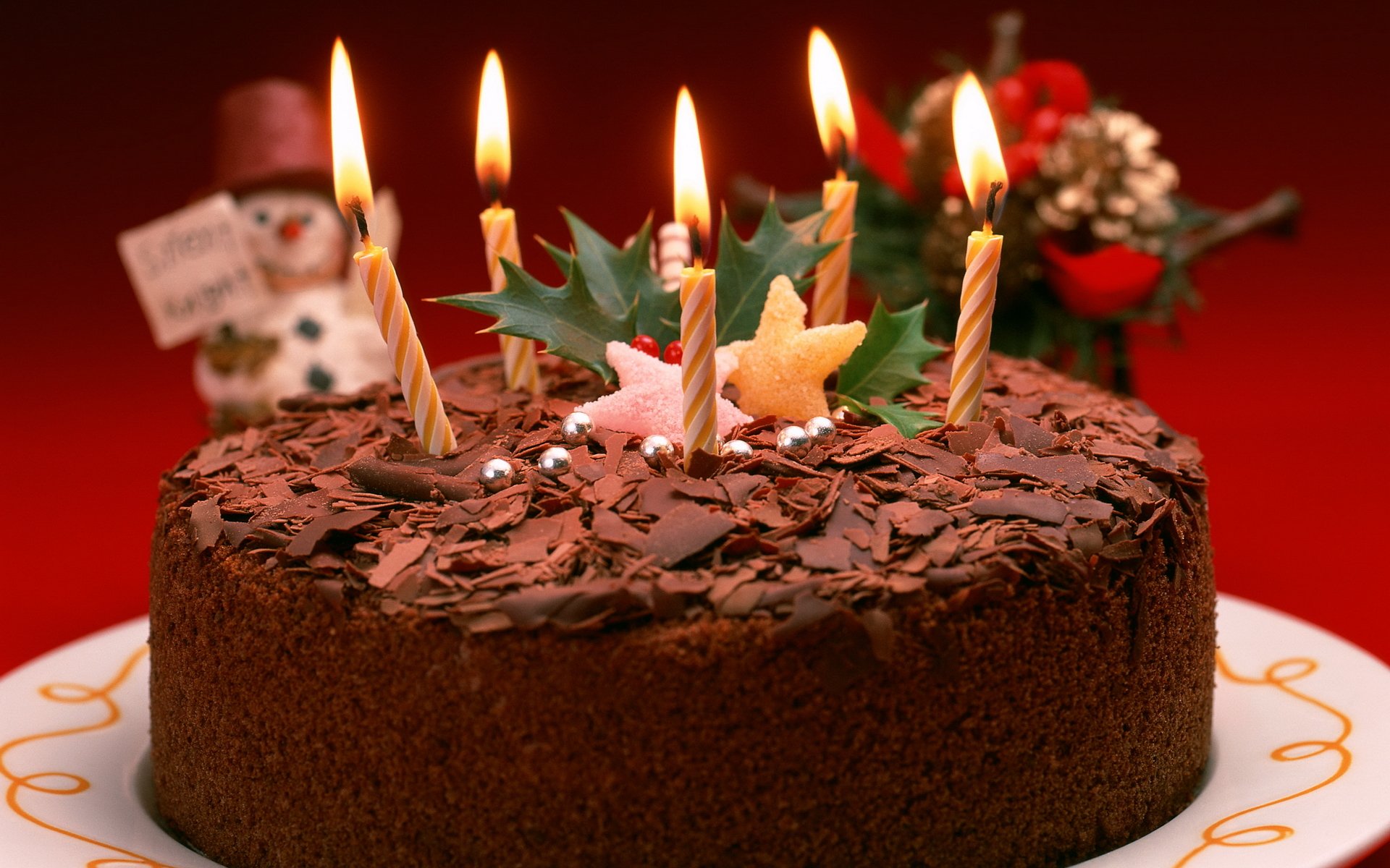 urlaub neujahr urlaub kuchen dessert süßigkeiten schokolade kerzen schneemann rot hintergrund