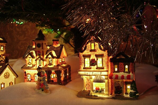 New Year decoration houses under the Christmas tree 