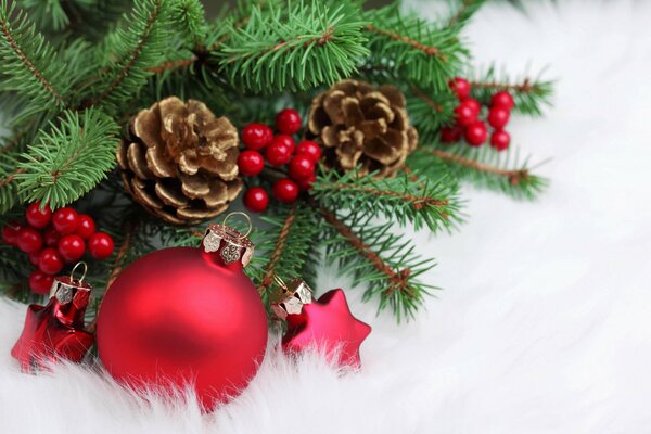 A bump on the Christmas tree and red toys are lying nearby