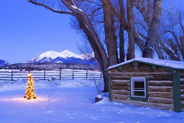 Cozy hut by the snowy mountains