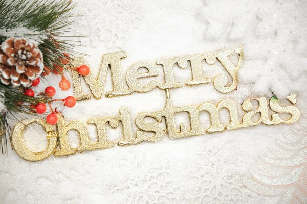 Three-dimensional inscription Merry Christmas with Christmas decorations