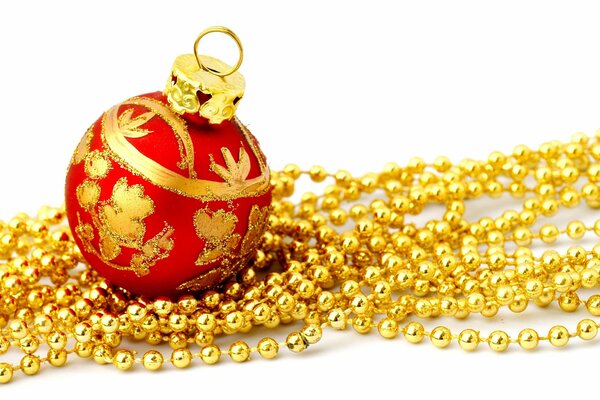 Beautiful red Christmas toy with golden beads