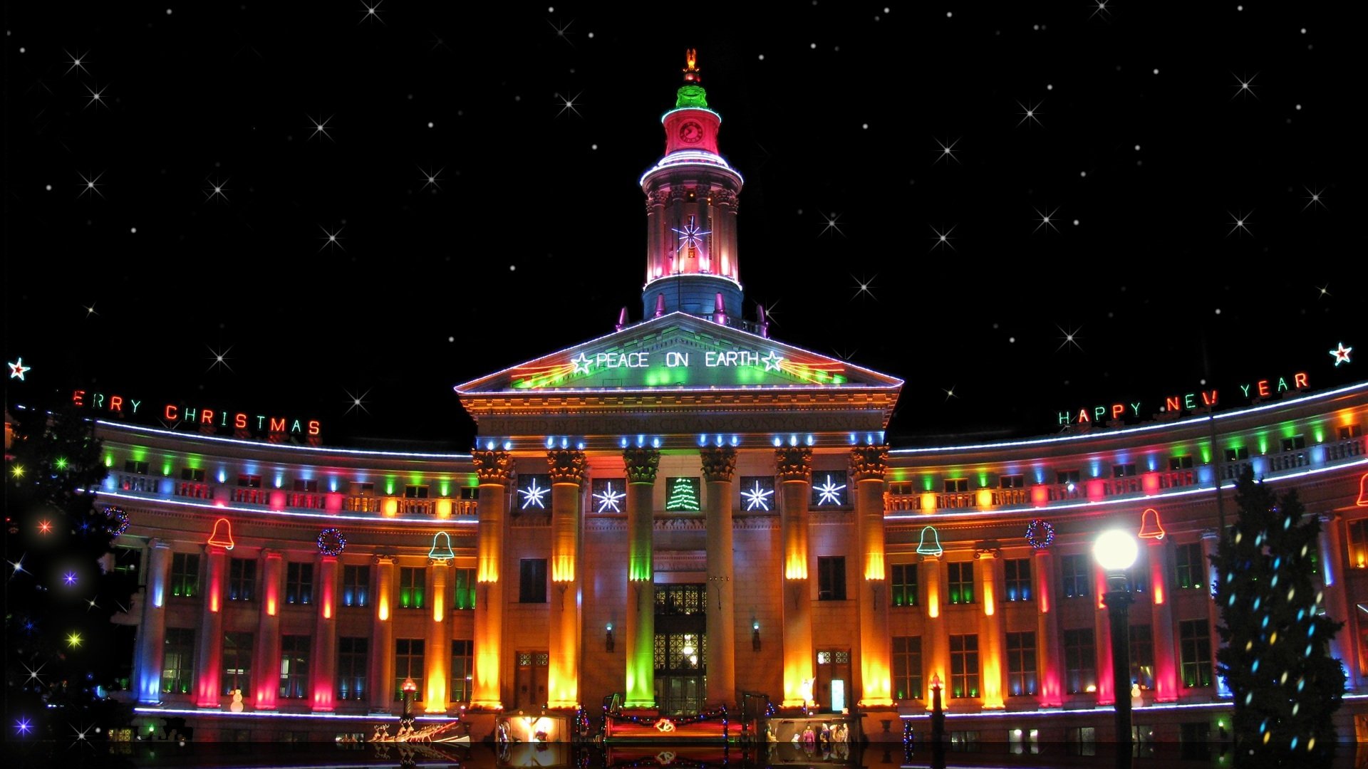 año nuevo ciudad edificio palabras feliz navidad feliz año nuevo paz en la tierra denver ee. uu. multicolor luces noche iluminación árboles de navidad torre reloj