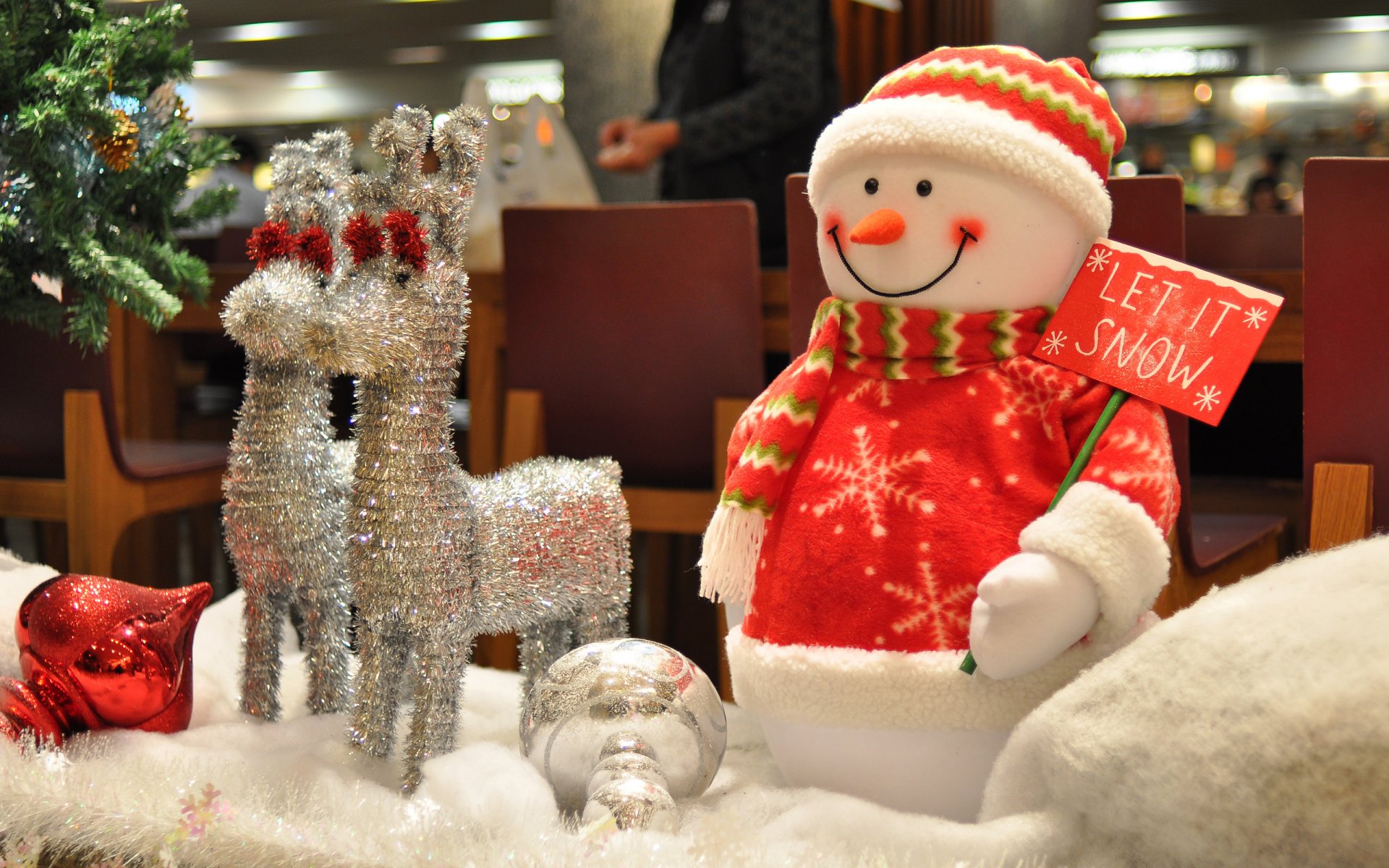 christmas toys snowman reindeer silver christmas tree close up