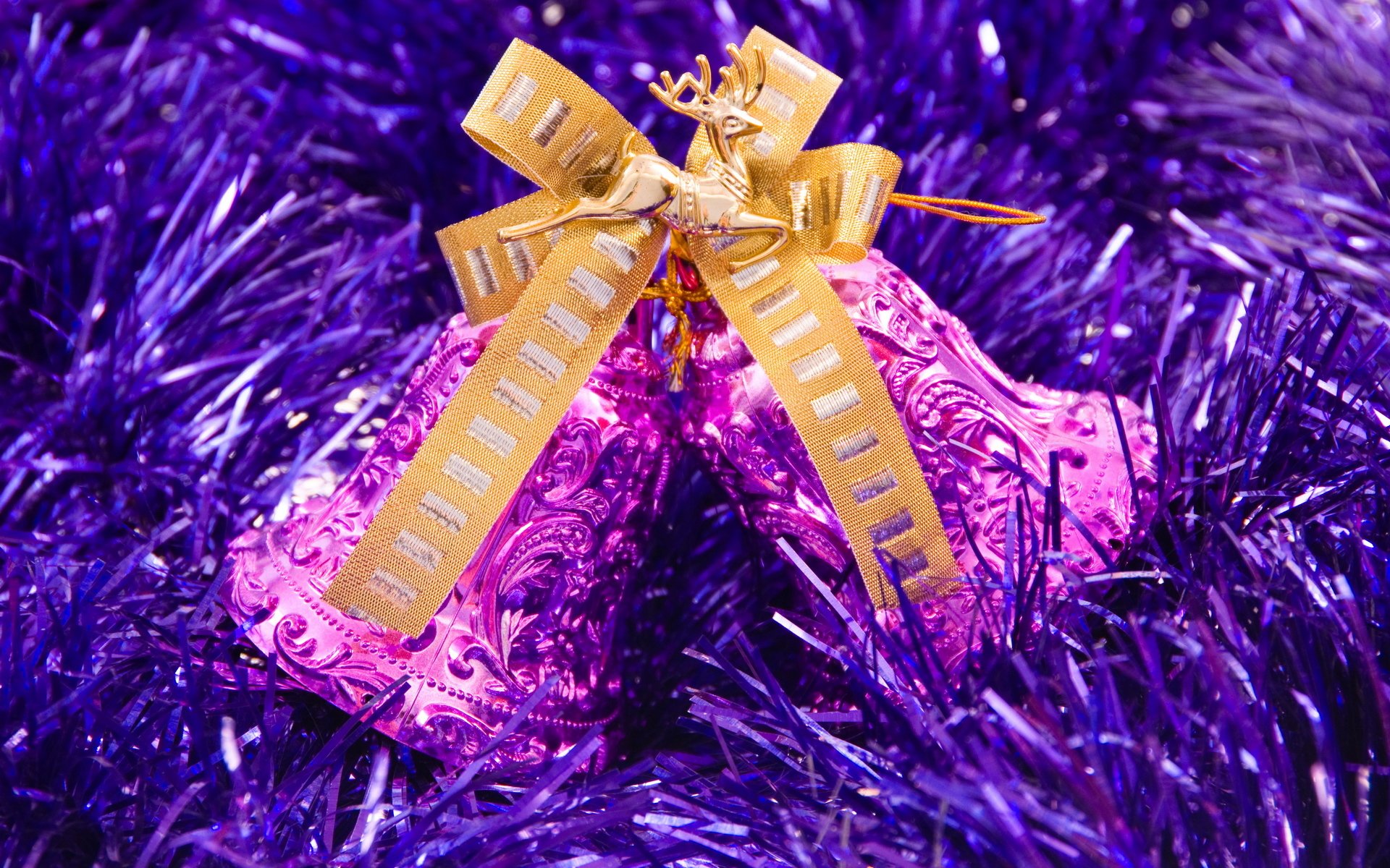 holiday new year purple tinsel pink bells gold bow figurine reindeer