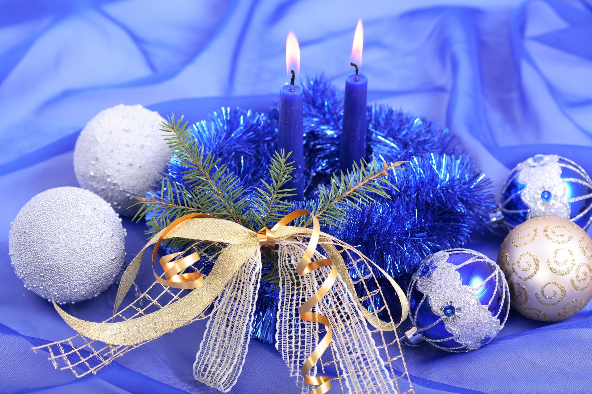 christmas composition candles balls tinsel belt bow branch blue silver sequin