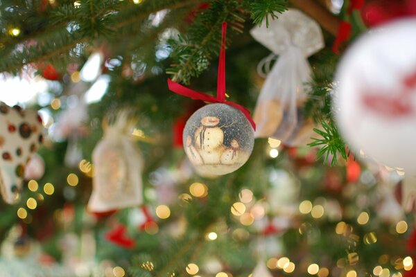 New Year s festive mood at the Christmas tree with toys