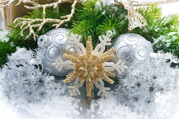 Christmas wallpaper with a Christmas tree, silver balls and a golden snowflake