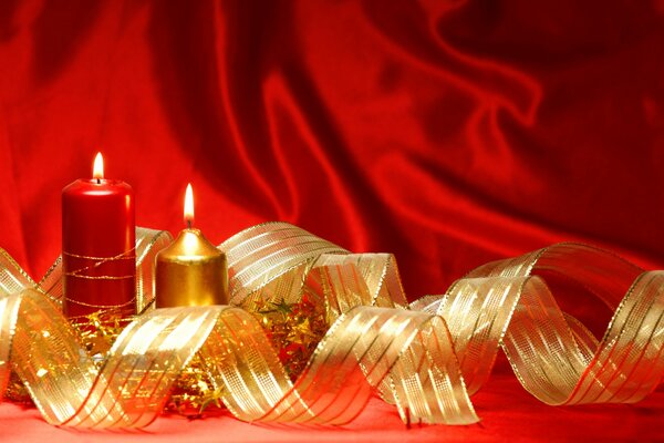 Lena and lit candles on a red background