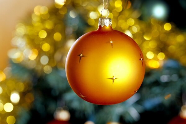 Yellow Christmas ball with stars