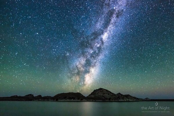 Milky Way from the sea side with mountain view