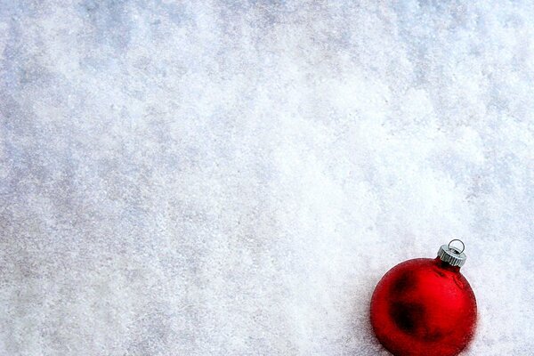 Red ball on white snow