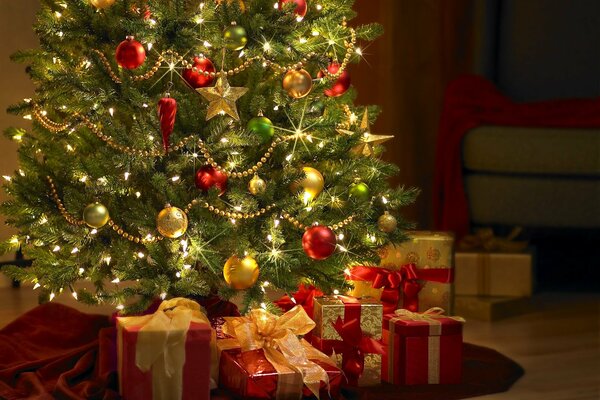 Decorated Christmas tree with garland and gifts