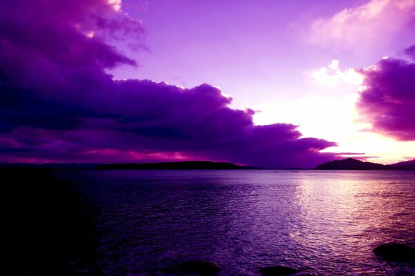 Cloudy sunset on a lake in the mountains