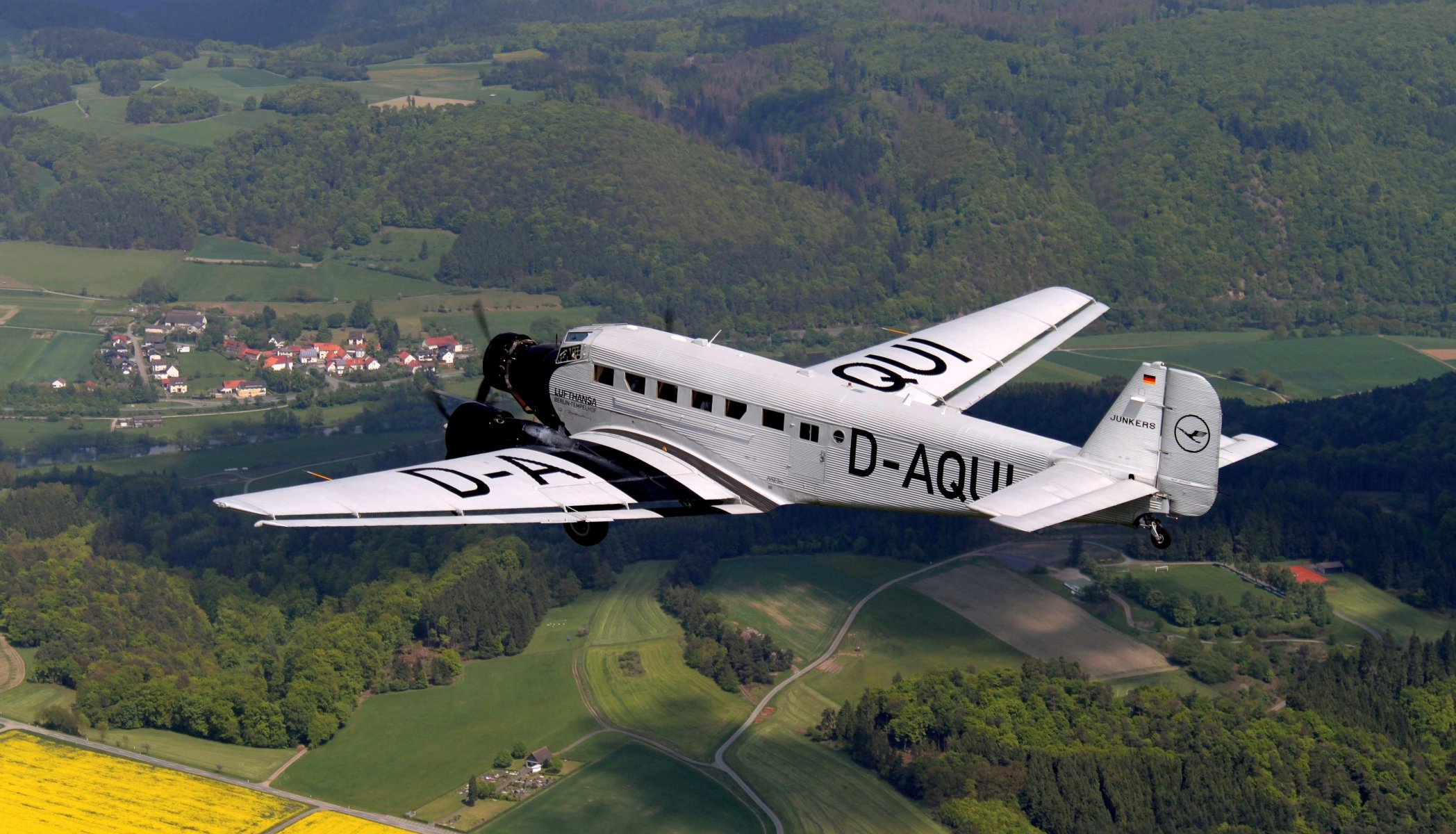 ky junkers ju-52 german transport plane land forest of the field road house