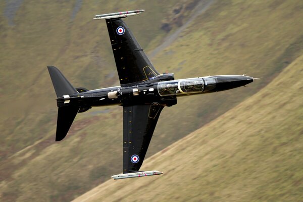 Photo of a black plane with a rocket