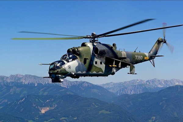 Helicopter gunship in the mountains. Good weather