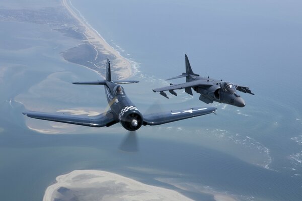 Two fighter-attack aircraft flying in the sky