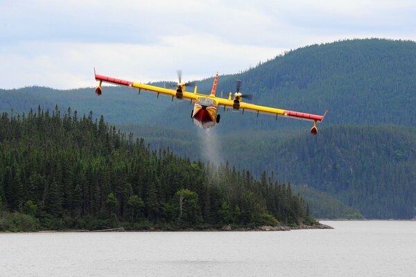 CL-415 flying over hills and forest