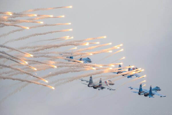 Fourth-generation Su-27 fighters. Fireworks show in the sky