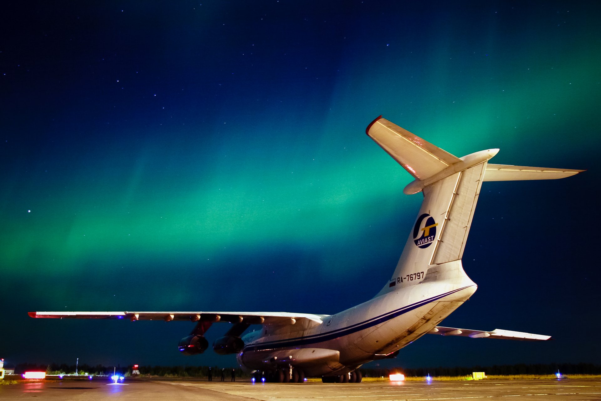 il-76 plane northern lights night north