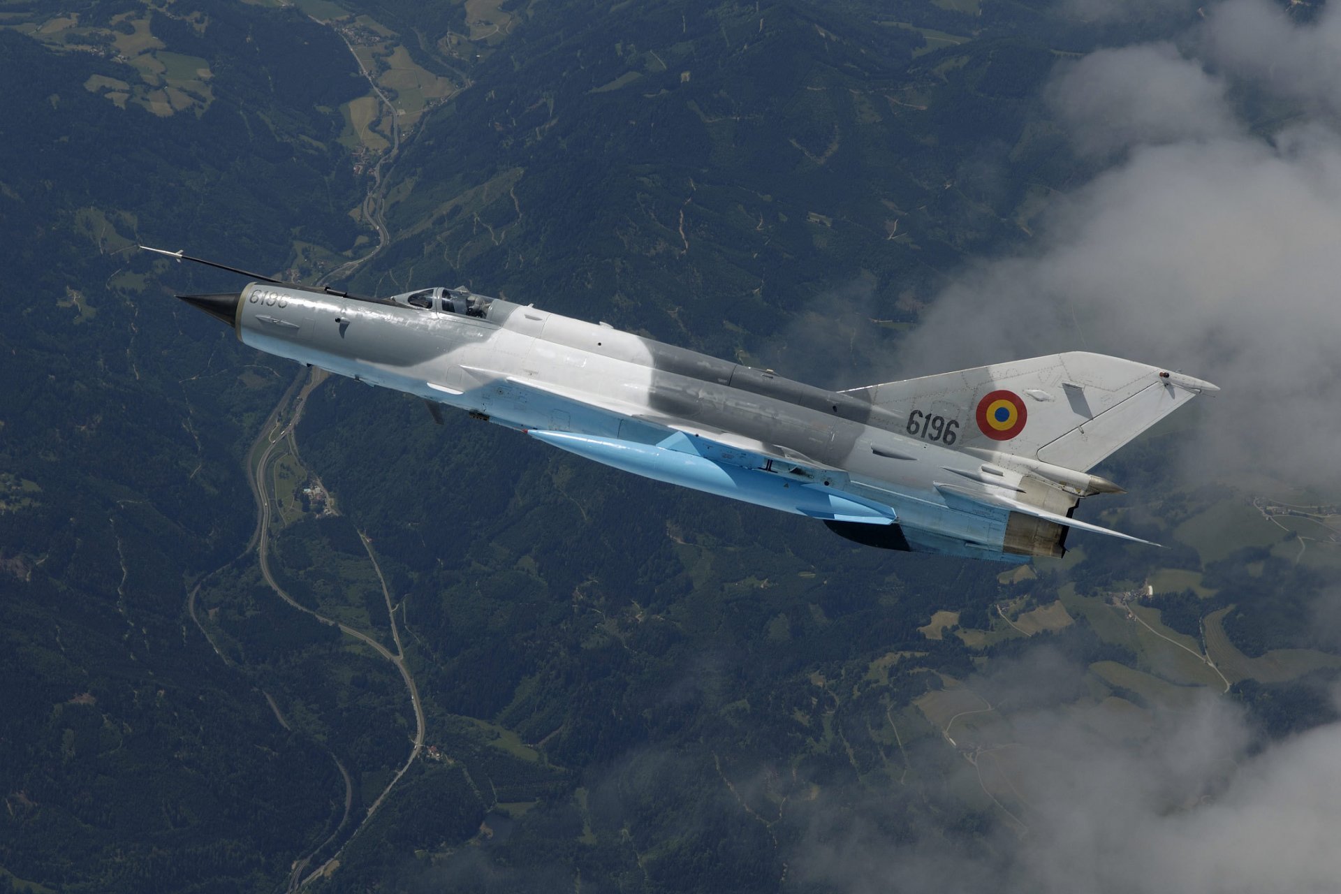 mikoyan and gurevich mig 21 lancer front fighter flight clouds view from the top