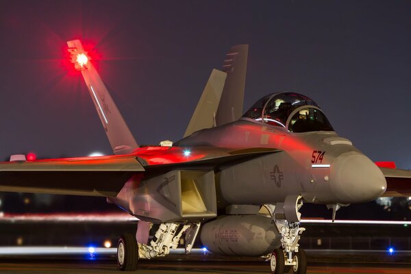 A military plane with weapons on board is ready for takeoff