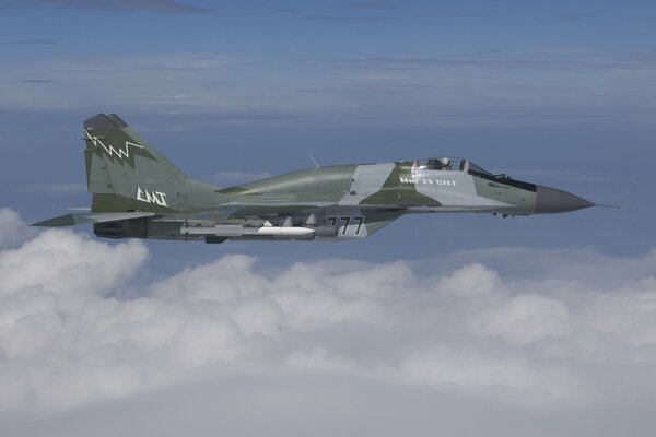 Russian fighter plane in the clouds