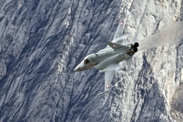 The F5e fighter is flying over the sea