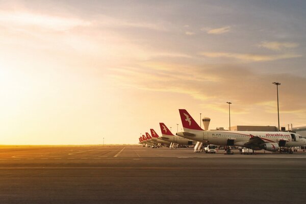 Beautiful photo of an airplane on the background of sunset