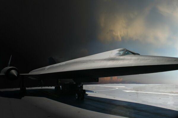 Plane blackbird at the training ground against the background of clouds