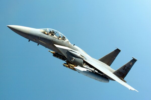 F-15 fighter jet on a blue sky background