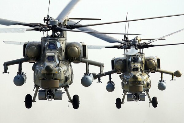 Two Mi-28n helicopters hover in the airspace