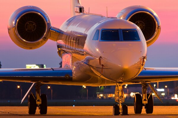 The plane is waiting to take off in the parking lot