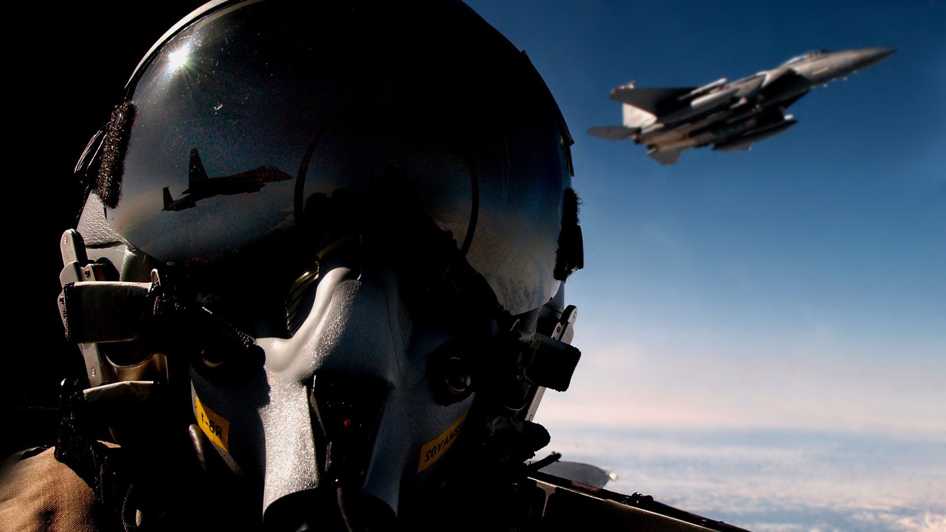 pilot fighter air helmet reflection in the sky plane