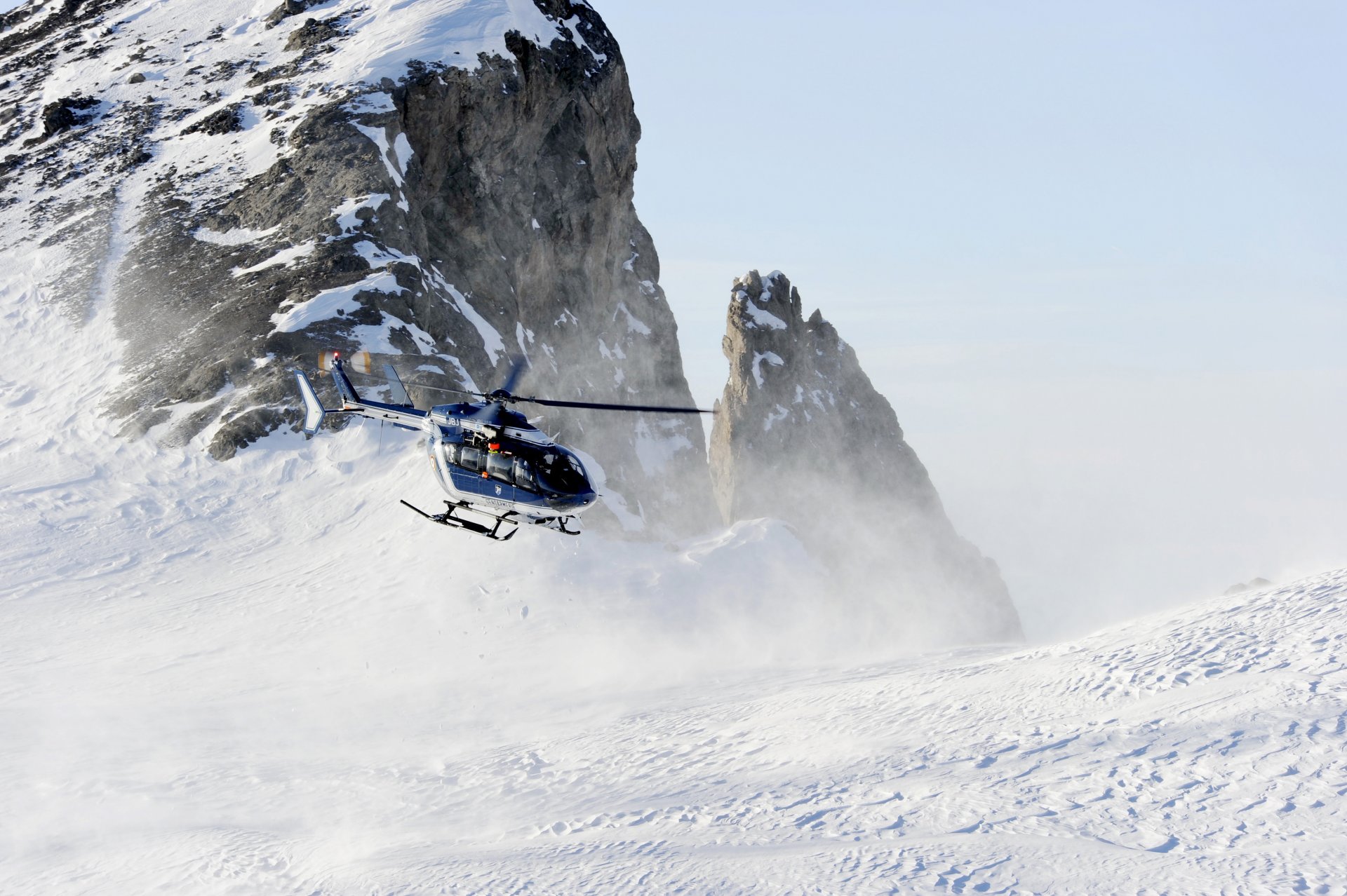 eurocopter ec145 snow mountain rock winter slope flight photo